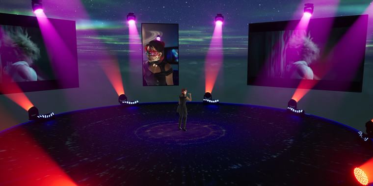 Wide view of the stage with beams and video screens